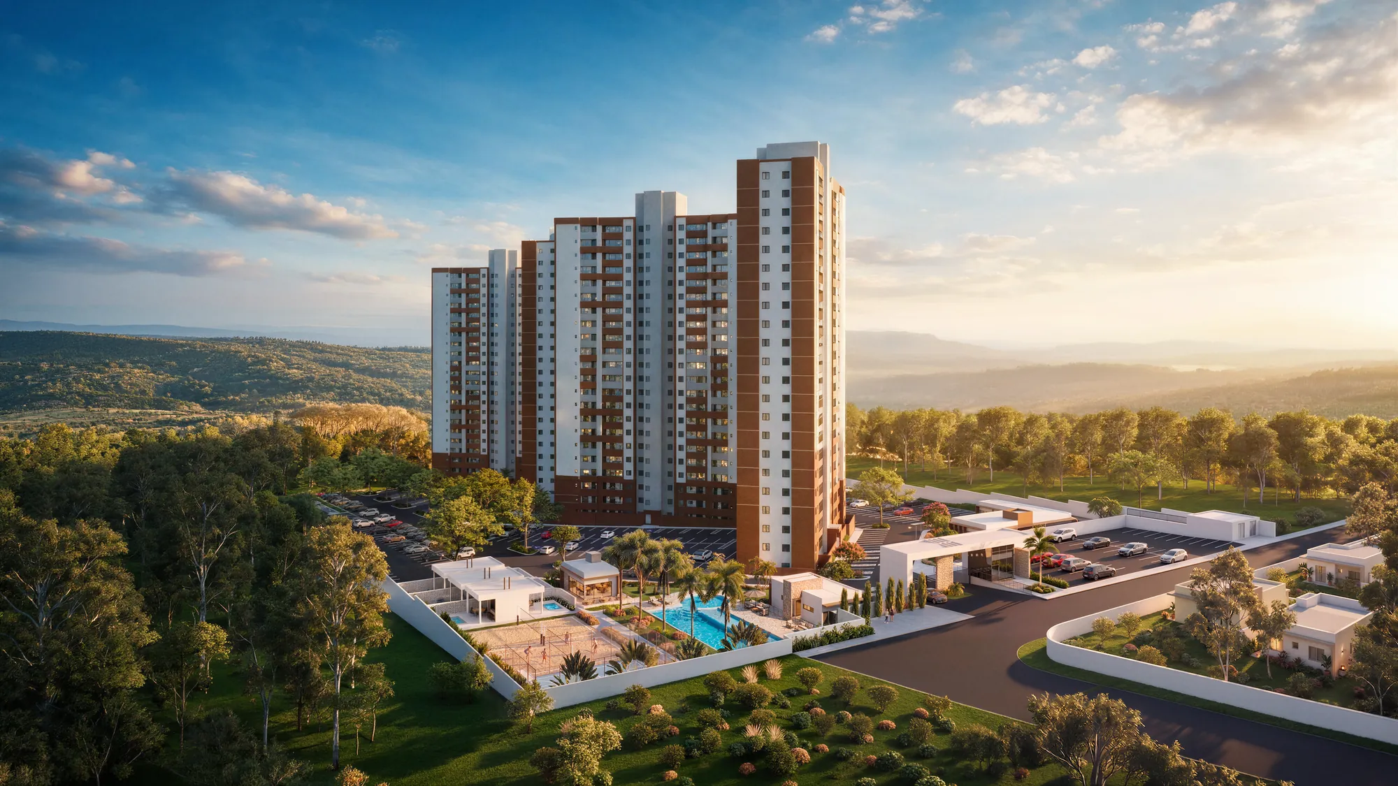 Implantação de um lançamento residencial: torres, área de lazer e portaria vistas do alto ao entardecer.